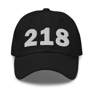 Black 218 area code hat with the state of Minnesota embroidered on the side.